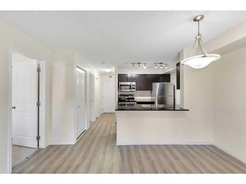 9112-403 Mackenzie Way, Airdrie, AB - Indoor Photo Showing Kitchen