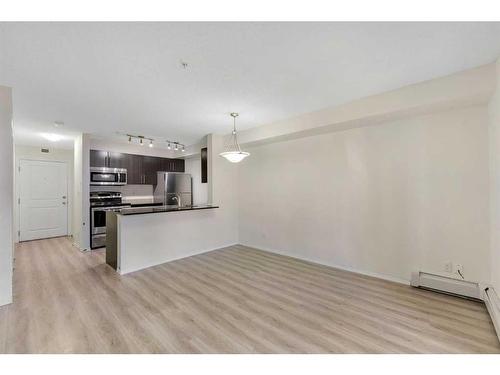 9112-403 Mackenzie Way, Airdrie, AB - Indoor Photo Showing Kitchen