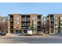 9112-403 Mackenzie Way, Airdrie, AB  - Outdoor With Balcony With Facade 