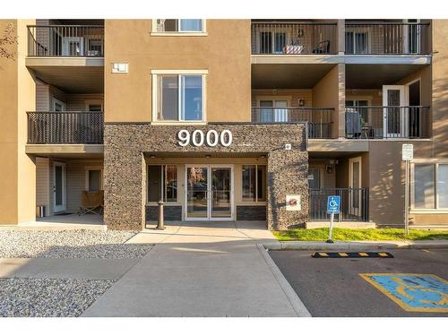 9112-403 Mackenzie Way, Airdrie, AB - Outdoor With Balcony With Facade