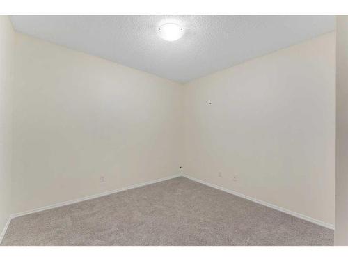 9112-403 Mackenzie Way, Airdrie, AB - Indoor Photo Showing Other Room