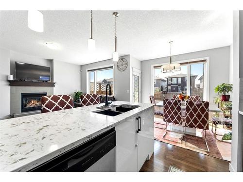 21 Redstone Road Ne, Calgary, AB - Indoor Photo Showing Kitchen With Fireplace