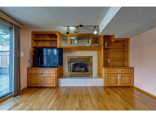 6527 Temple Drive Ne, Calgary, AB - Indoor Photo Showing Living Room With Fireplace