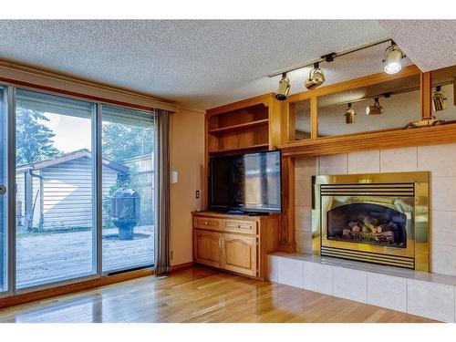 6527 Temple Drive Ne, Calgary, AB - Indoor Photo Showing Living Room With Fireplace