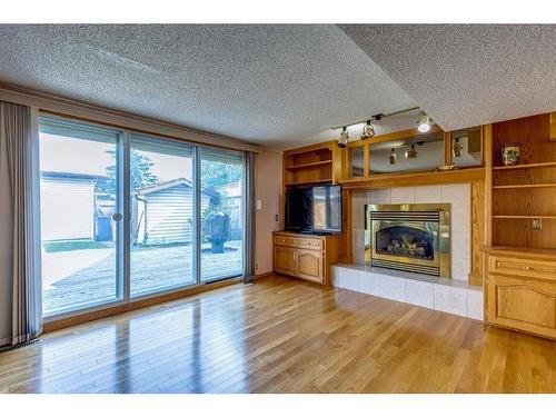 6527 Temple Drive Ne, Calgary, AB - Indoor Photo Showing Living Room With Fireplace