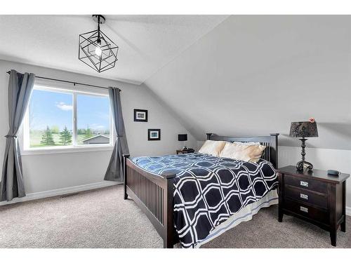 31 Braemar Glen Road, Rural Rocky View County, AB - Indoor Photo Showing Bedroom