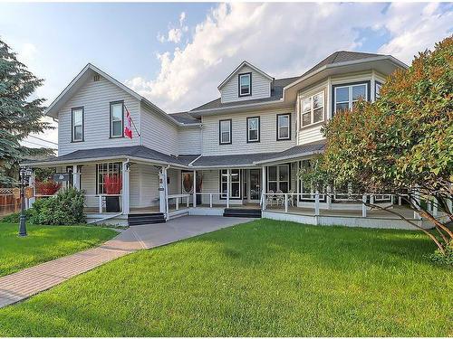 2 Elma Street West, Okotoks, AB - Outdoor With Deck Patio Veranda With Facade