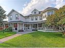 2 Elma Street West, Okotoks, AB  - Outdoor With Deck Patio Veranda With Facade 