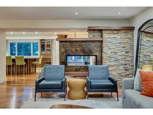 100 Mapleburn Drive Se, Calgary, AB - Indoor Photo Showing Living Room With Fireplace