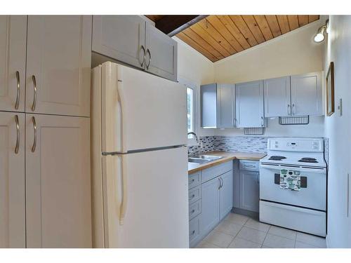 303 Pinemont Gate Ne, Calgary, AB - Indoor Photo Showing Kitchen With Double Sink