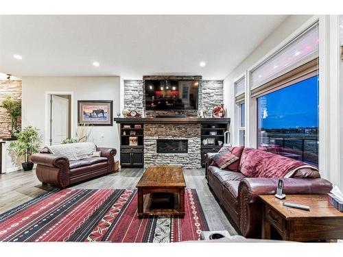 220 Stonemere Close, Chestermere, AB - Indoor Photo Showing Living Room With Fireplace