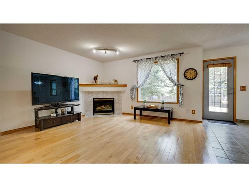 863 Tuscany Drive Nw, Calgary, AB - Indoor Photo Showing Living Room With Fireplace