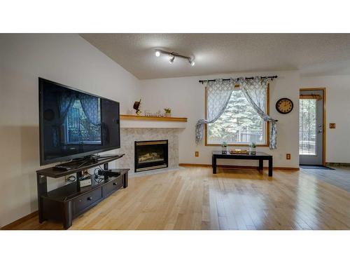 863 Tuscany Drive Nw, Calgary, AB - Indoor Photo Showing Living Room With Fireplace