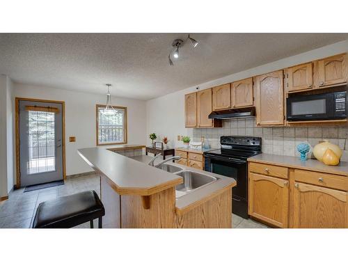 863 Tuscany Drive Nw, Calgary, AB - Indoor Photo Showing Kitchen With Double Sink