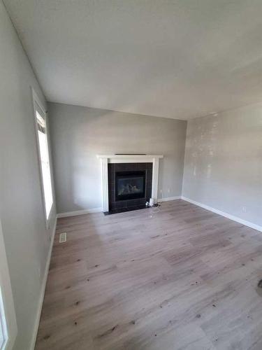 233 Evansdale Way Nw, Calgary, AB - Indoor Photo Showing Living Room With Fireplace