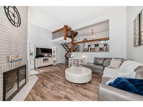 7-10401 19 Street Sw, Calgary, AB - Indoor Photo Showing Living Room With Fireplace