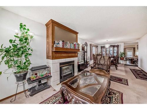 24 Carmel Place Ne, Calgary, AB - Indoor Photo Showing Living Room With Fireplace