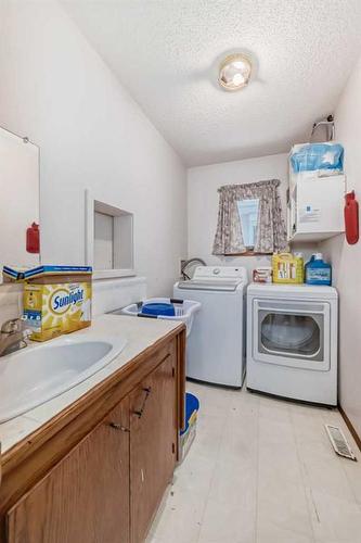 24 Carmel Place Ne, Calgary, AB - Indoor Photo Showing Laundry Room