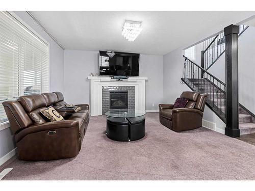 44 Rainbow Falls Boulevard, Chestermere, AB - Indoor Photo Showing Other Room With Fireplace