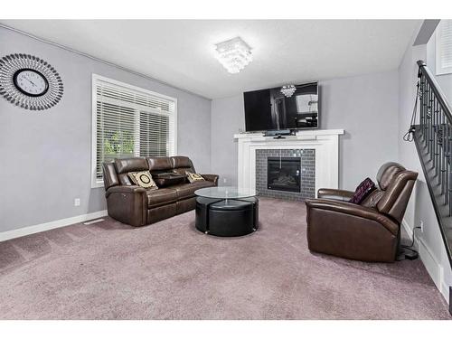 44 Rainbow Falls Boulevard, Chestermere, AB - Indoor Photo Showing Other Room With Fireplace