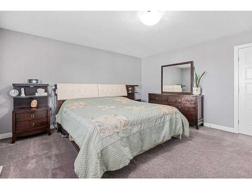 44 Rainbow Falls Boulevard, Chestermere, AB - Indoor Photo Showing Bedroom