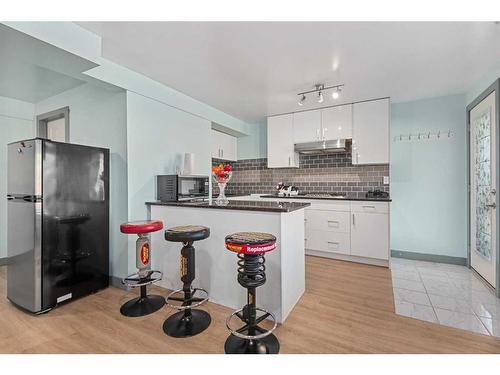 44 Rainbow Falls Boulevard, Chestermere, AB - Indoor Photo Showing Kitchen With Upgraded Kitchen