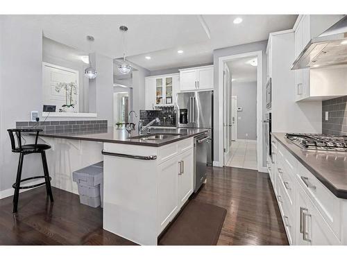 44 Rainbow Falls Boulevard, Chestermere, AB - Indoor Photo Showing Kitchen With Double Sink With Upgraded Kitchen