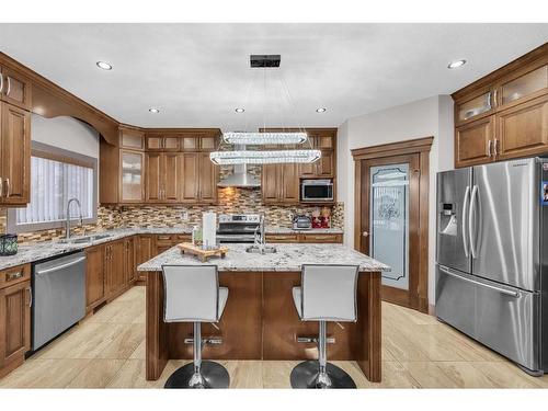 348 Kinniburgh Boulevard, Chestermere, AB - Indoor Photo Showing Kitchen With Double Sink