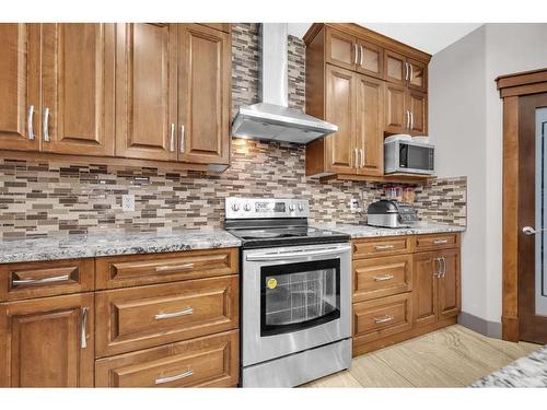 348 Kinniburgh Boulevard, Chestermere, AB - Indoor Photo Showing Kitchen