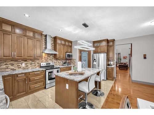 348 Kinniburgh Boulevard, Chestermere, AB - Indoor Photo Showing Kitchen With Upgraded Kitchen