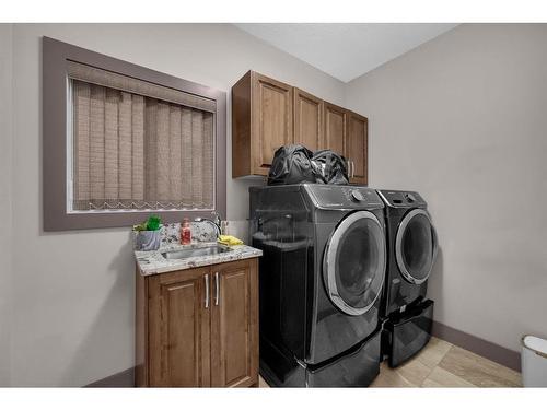 348 Kinniburgh Boulevard, Chestermere, AB - Indoor Photo Showing Laundry Room