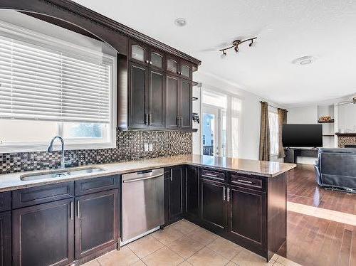 8 Castlebury Way Ne, Calgary, AB - Indoor Photo Showing Kitchen With Double Sink