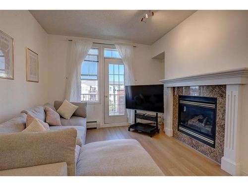 5413-14645 6 Street Sw, Calgary, AB - Indoor Photo Showing Living Room With Fireplace