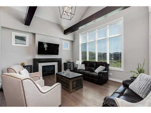 203 Cranbrook Circle Se, Calgary, AB - Indoor Photo Showing Living Room With Fireplace