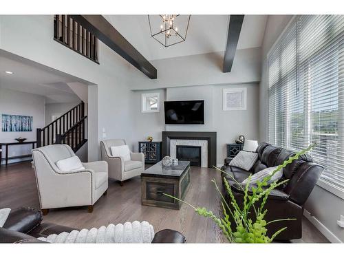 203 Cranbrook Circle Se, Calgary, AB - Indoor Photo Showing Living Room With Fireplace