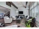 203 Cranbrook Circle Se, Calgary, AB  - Indoor Photo Showing Living Room With Fireplace 