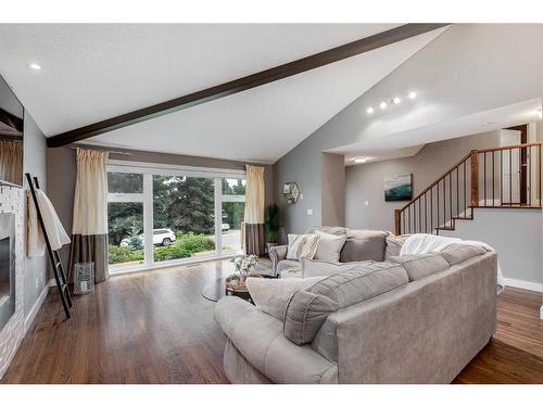 11 Woodlark Drive Sw, Calgary, AB - Indoor Photo Showing Living Room With Fireplace