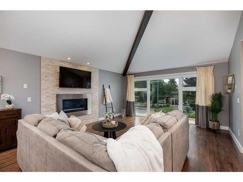 11 Woodlark Drive Sw, Calgary, AB - Indoor Photo Showing Living Room With Fireplace