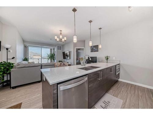 507-2231 Mahogany Boulevard Se, Calgary, AB - Indoor Photo Showing Kitchen With Double Sink With Upgraded Kitchen