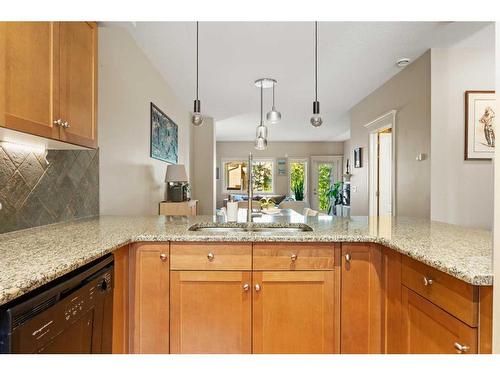 110-1909 36 Avenue Sw, Calgary, AB - Indoor Photo Showing Kitchen With Double Sink