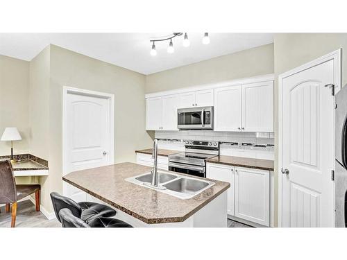 103-31 Panatella Landing Nw, Calgary, AB - Indoor Photo Showing Kitchen With Double Sink