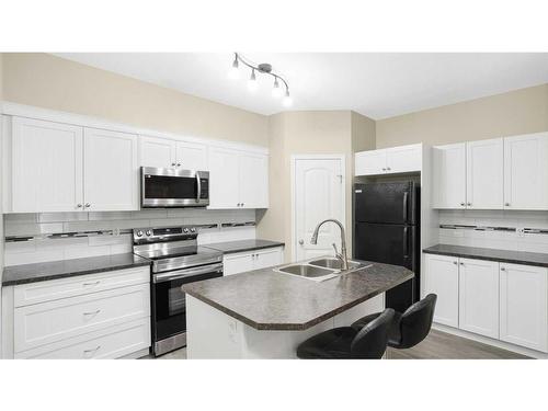 103-31 Panatella Landing Nw, Calgary, AB - Indoor Photo Showing Kitchen With Double Sink