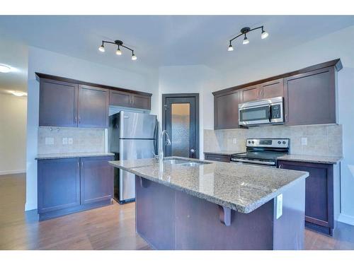 506 Williamstown Green Nw, Airdrie, AB - Indoor Photo Showing Kitchen With Stainless Steel Kitchen With Double Sink With Upgraded Kitchen