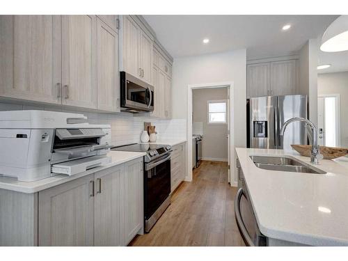 2773 Baywater Landing Sw, Airdrie, AB - Indoor Photo Showing Kitchen With Double Sink With Upgraded Kitchen