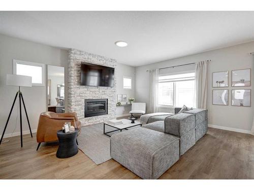 2773 Baywater Landing Sw, Airdrie, AB - Indoor Photo Showing Living Room With Fireplace