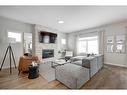 2773 Baywater Landing Sw, Airdrie, AB  - Indoor Photo Showing Living Room With Fireplace 