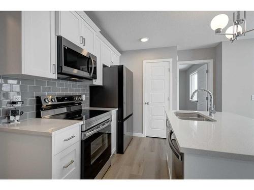 2773 Baywater Landing Sw, Airdrie, AB - Indoor Photo Showing Kitchen With Double Sink With Upgraded Kitchen