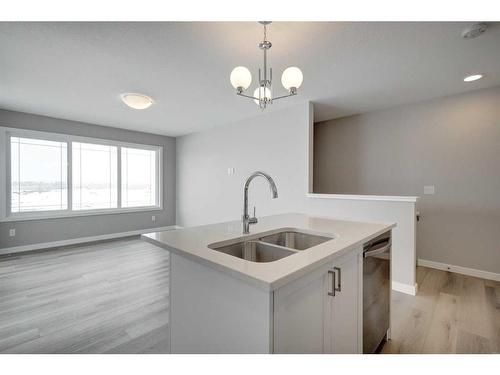 2773 Baywater Landing Sw, Airdrie, AB - Indoor Photo Showing Kitchen With Double Sink