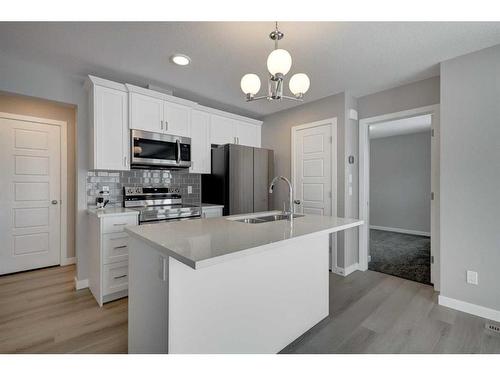 2773 Baywater Landing Sw, Airdrie, AB - Indoor Photo Showing Kitchen With Double Sink With Upgraded Kitchen