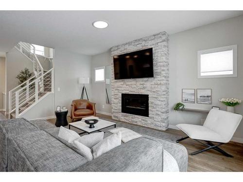 2773 Baywater Landing Sw, Airdrie, AB - Indoor Photo Showing Living Room With Fireplace